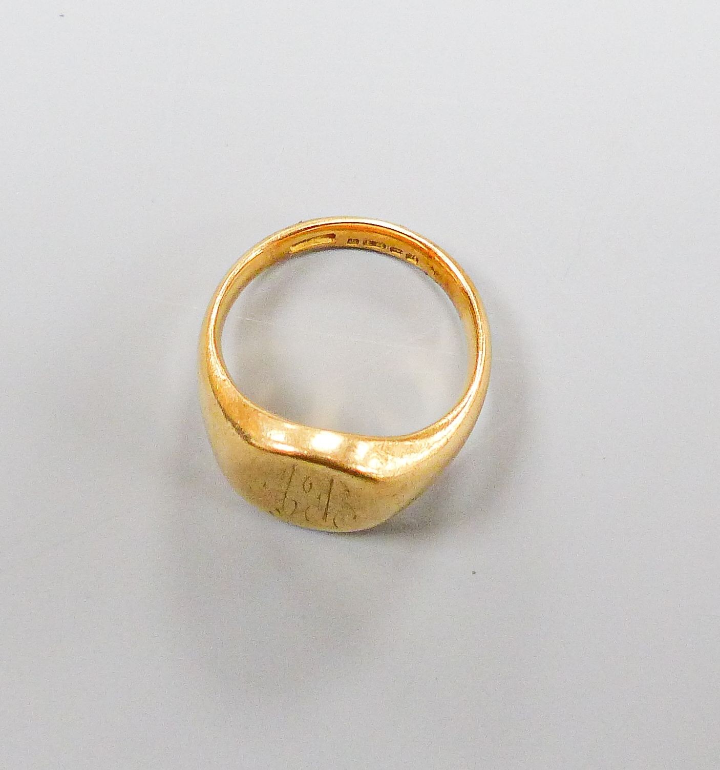 A 1950's 19ct gold signet ring, with engraved inscription, size M, 14.3 grams.